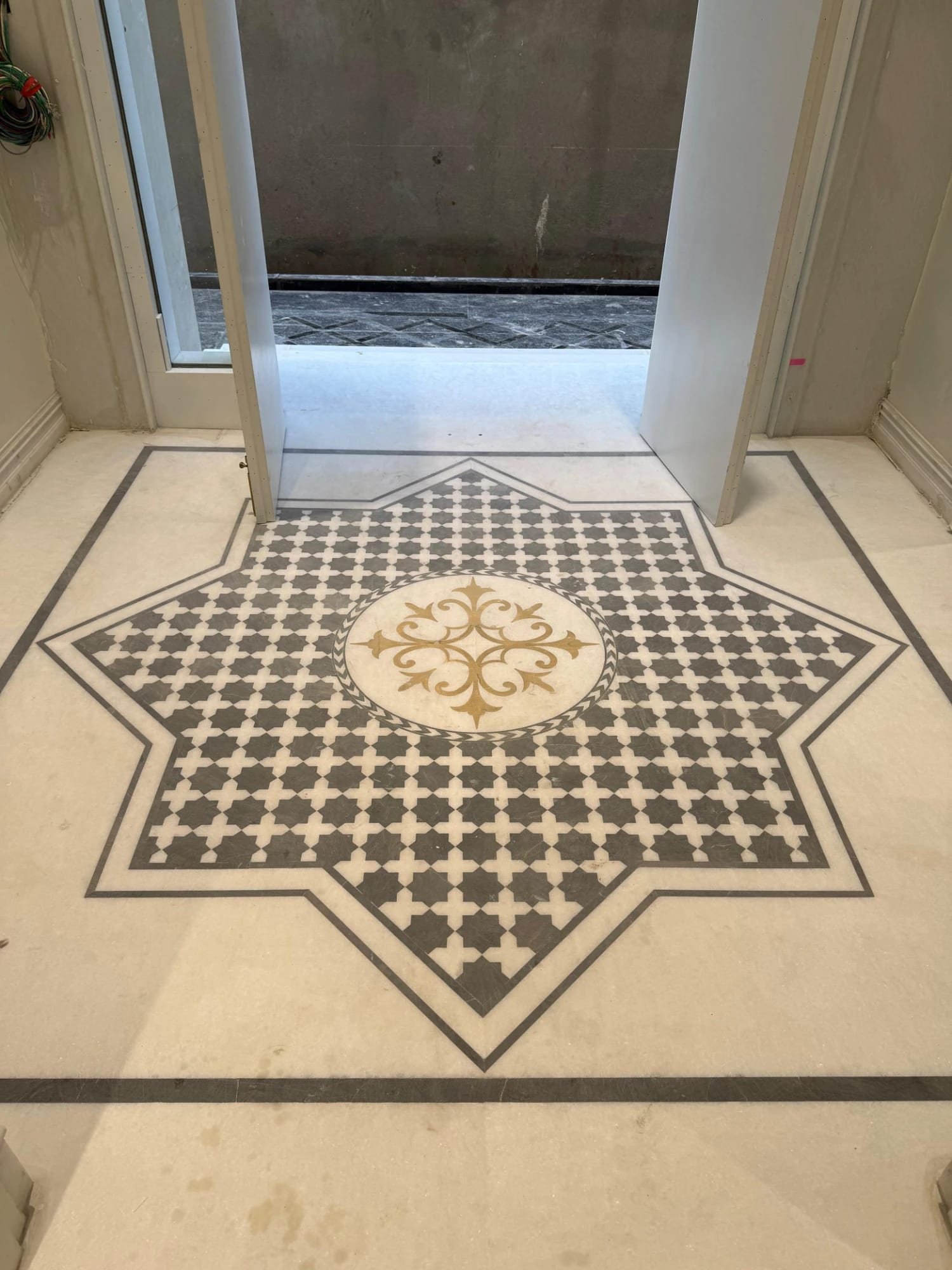 Star medallion floor — carved in marble, grey stone & brass